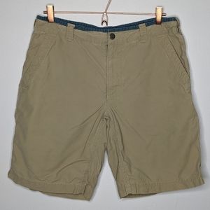 Men’s North Face tan shorts size 34.
